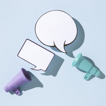 top-view-megaphones-speech-bubbles